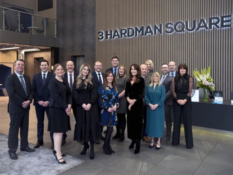 Manchester law firm celebrates family legal aid contract